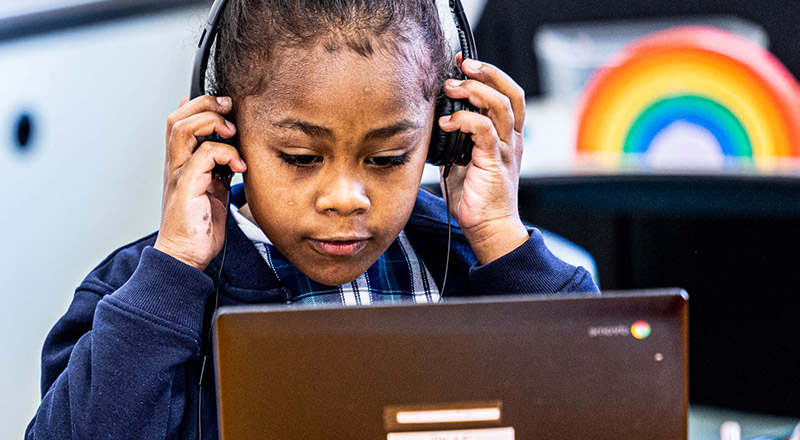 Holy Family Catholic Primary Emerton student wearing headset