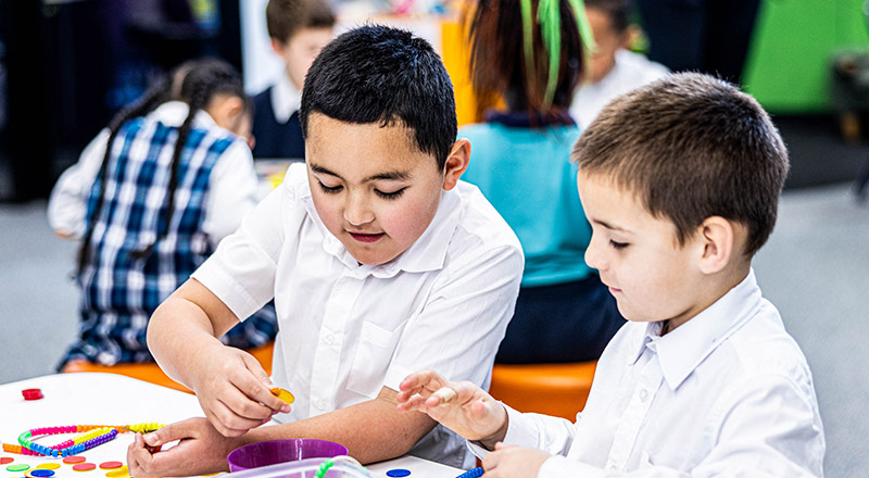 Two Holy Family Catholic Primary Emerton students in class