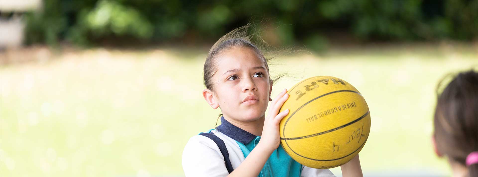 Holy Family Primary Emerton student shooting hoops