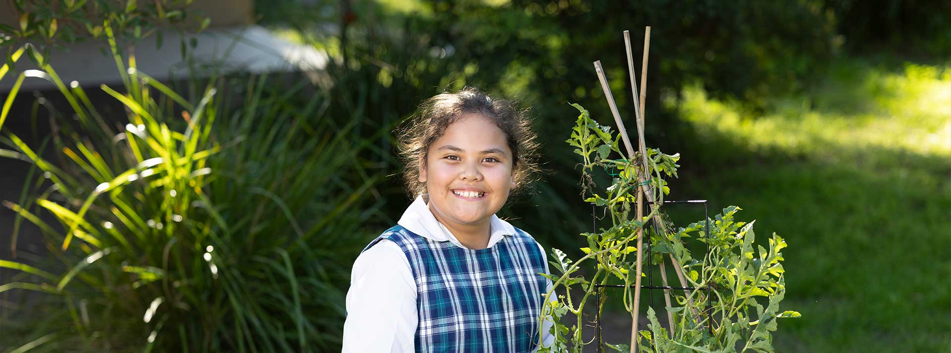 Girl gardening at Holy Family Primary Emerton