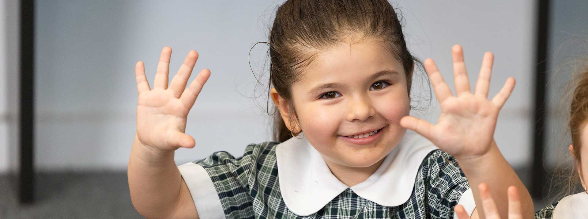 Holy Family Primary Emerton student counting on her fingers