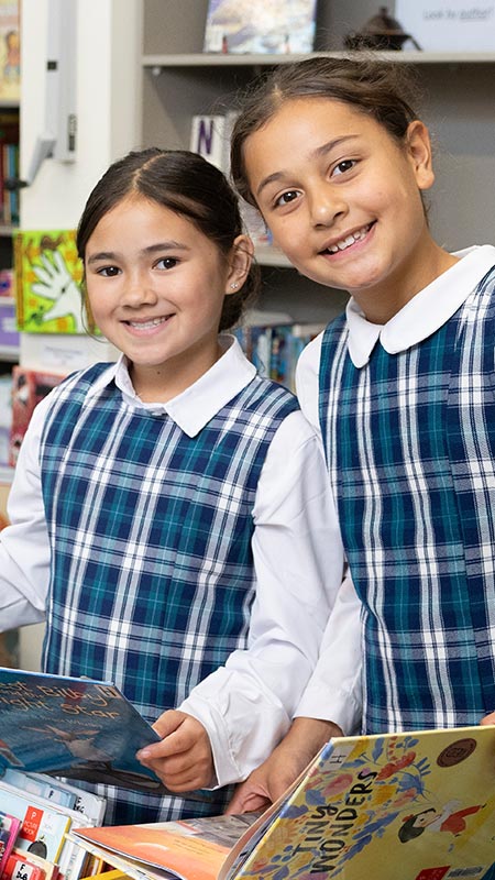 Holy Family Primary Emerton students in school library
