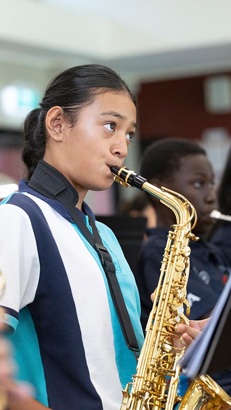 Holy Family Primary student playing Saxaphone