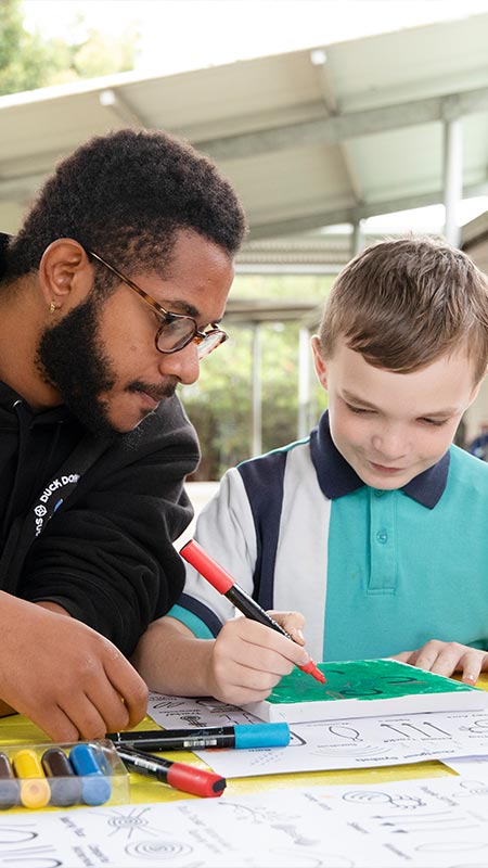 Students painting at Holy Family Primary Emerton