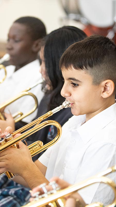 Holy Family Primary Emerton student playing trumpet in school band