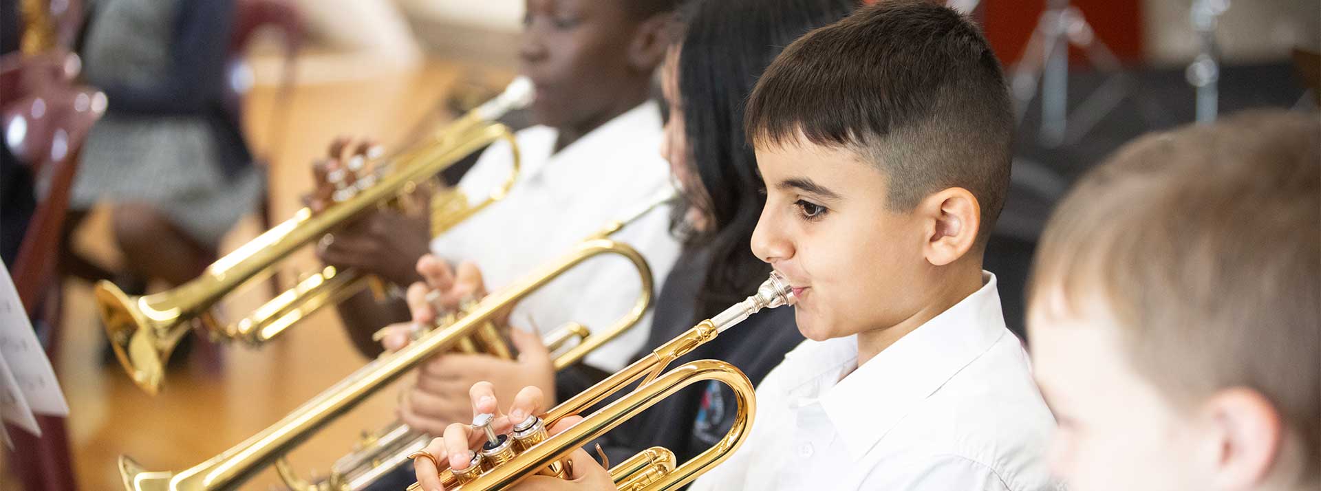 Holy Family Primary Emerton student playing trumpet in school band