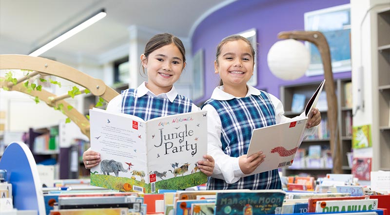 Holy Family Primary Emerton students in school library