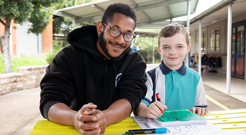 Holy Family Primary Emerton students painting Aboriginal Artwork