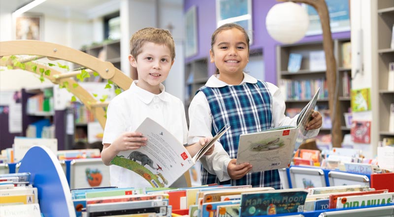 Holy Family Primary Emerton students in library