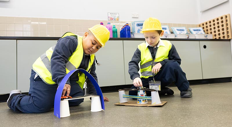 Two Holy Family Primary Emerton students playing