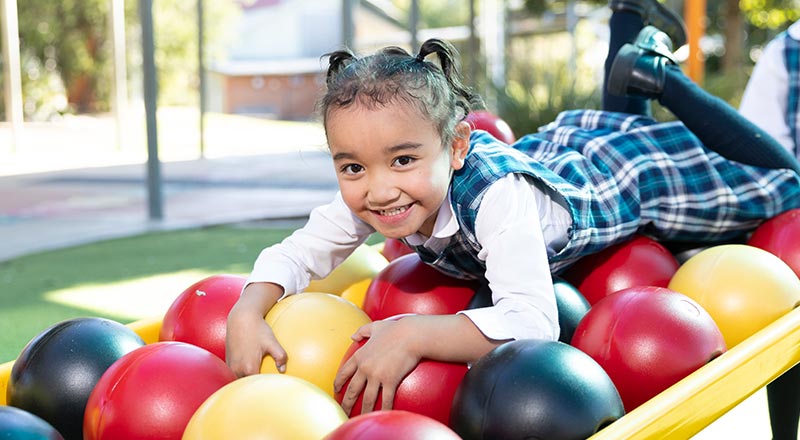 Holy family Primary Emerton student on play equipment