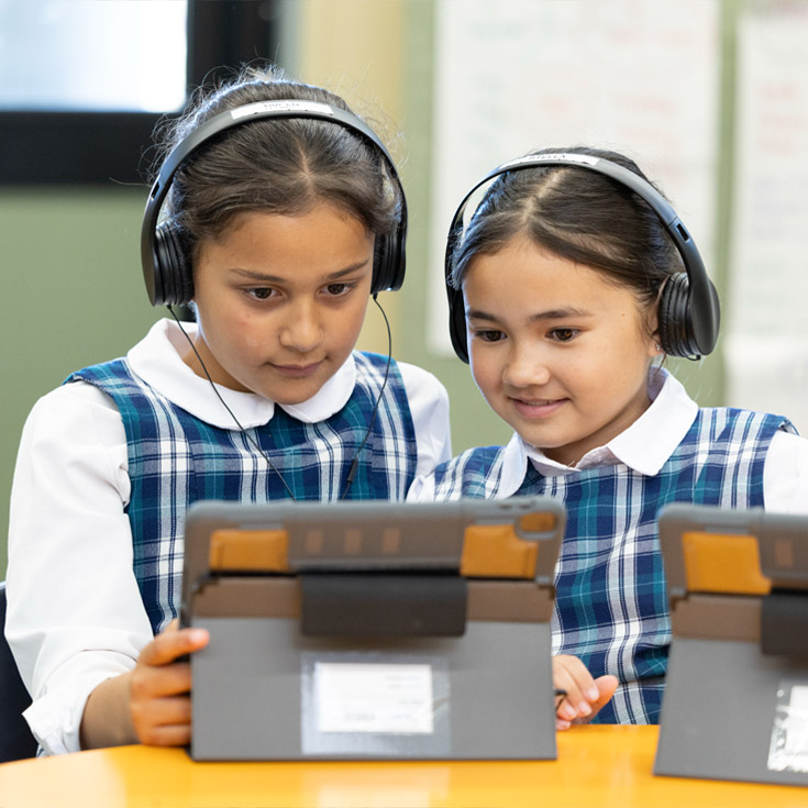 Holy Family Primary Emerton students in class using iPads