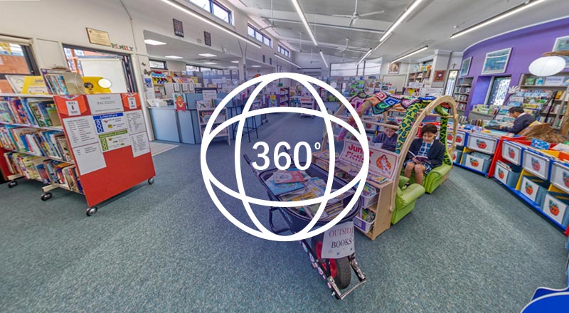 Preview of the 360 virtual tour. It is a screenshot of the school library section of the tour, with a 360 degree logo superimposed.